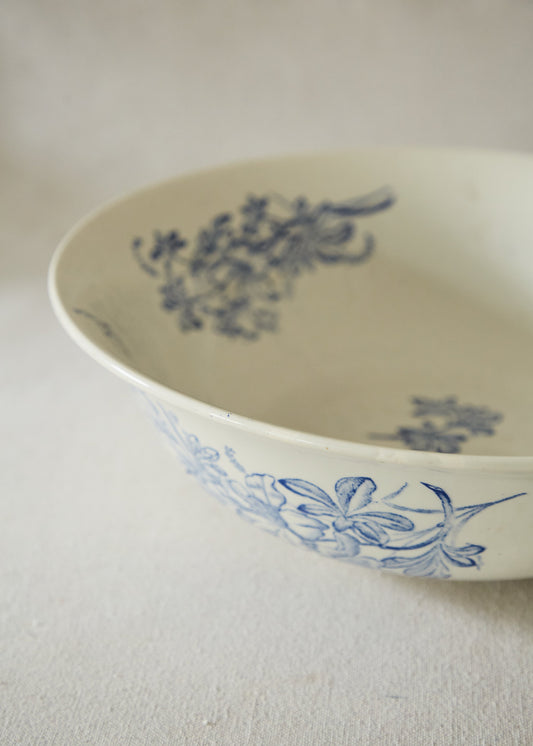 Large white ceramic wash bowl with blue flower print