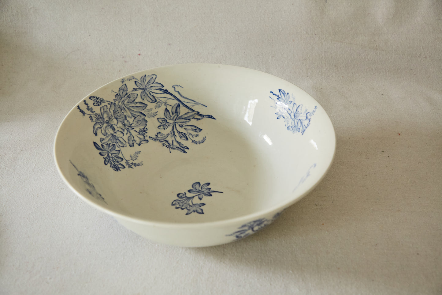 Large white ceramic wash bowl with blue flower print