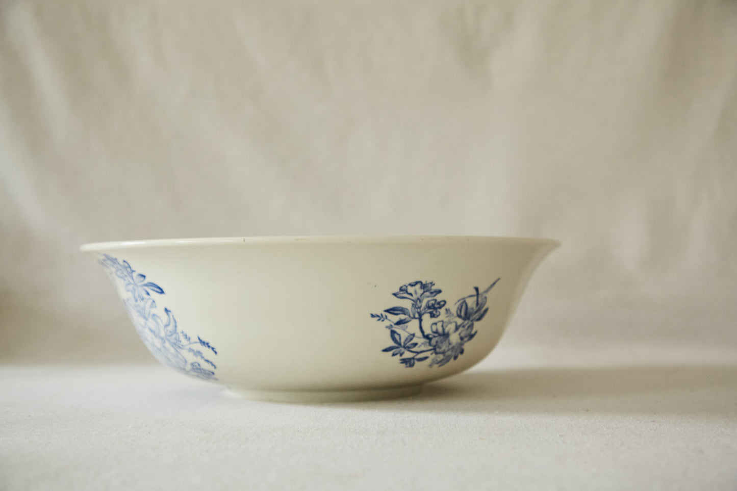 Large white ceramic wash bowl with blue flower print
