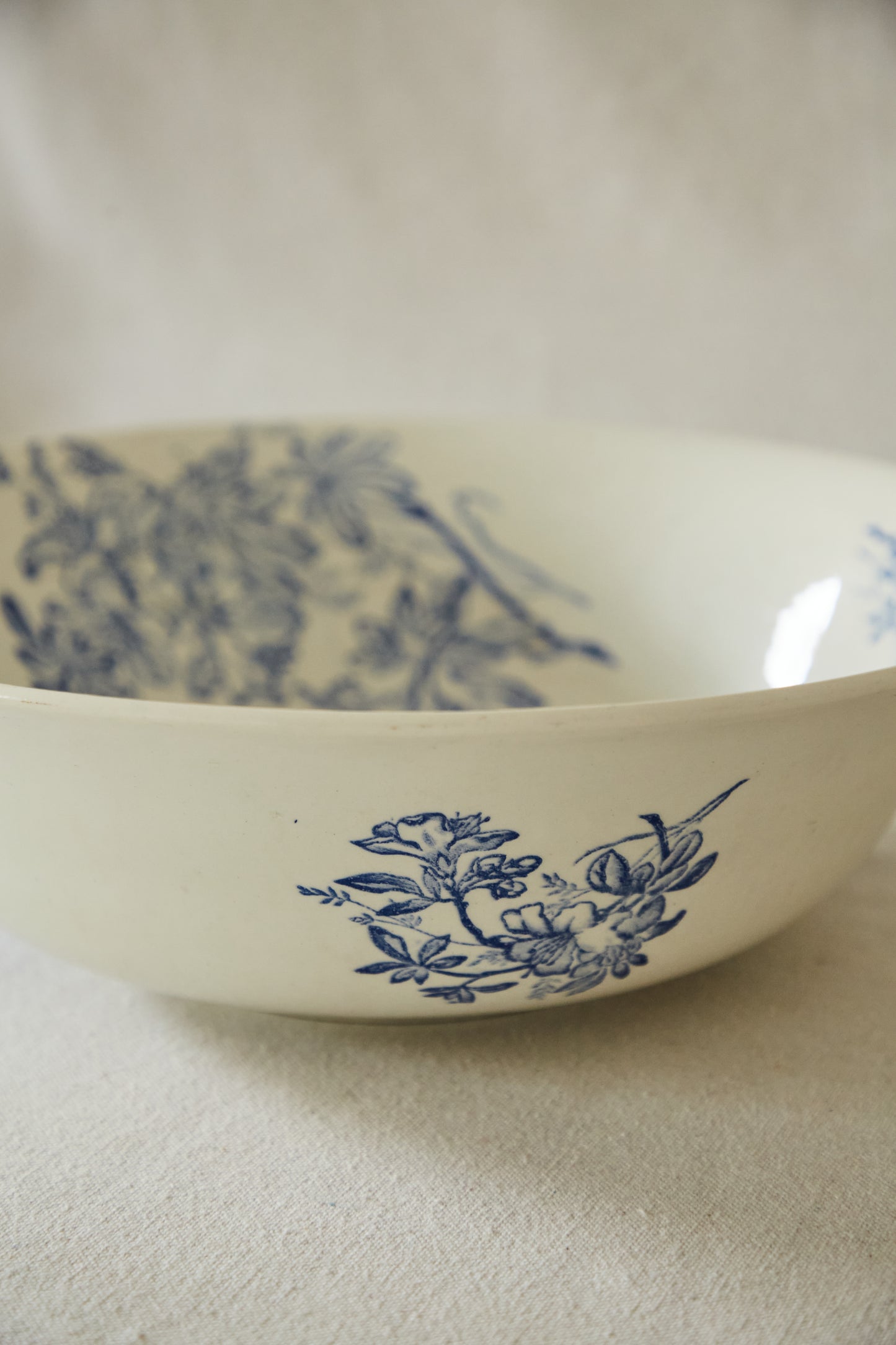 Large white ceramic wash bowl with blue flower print