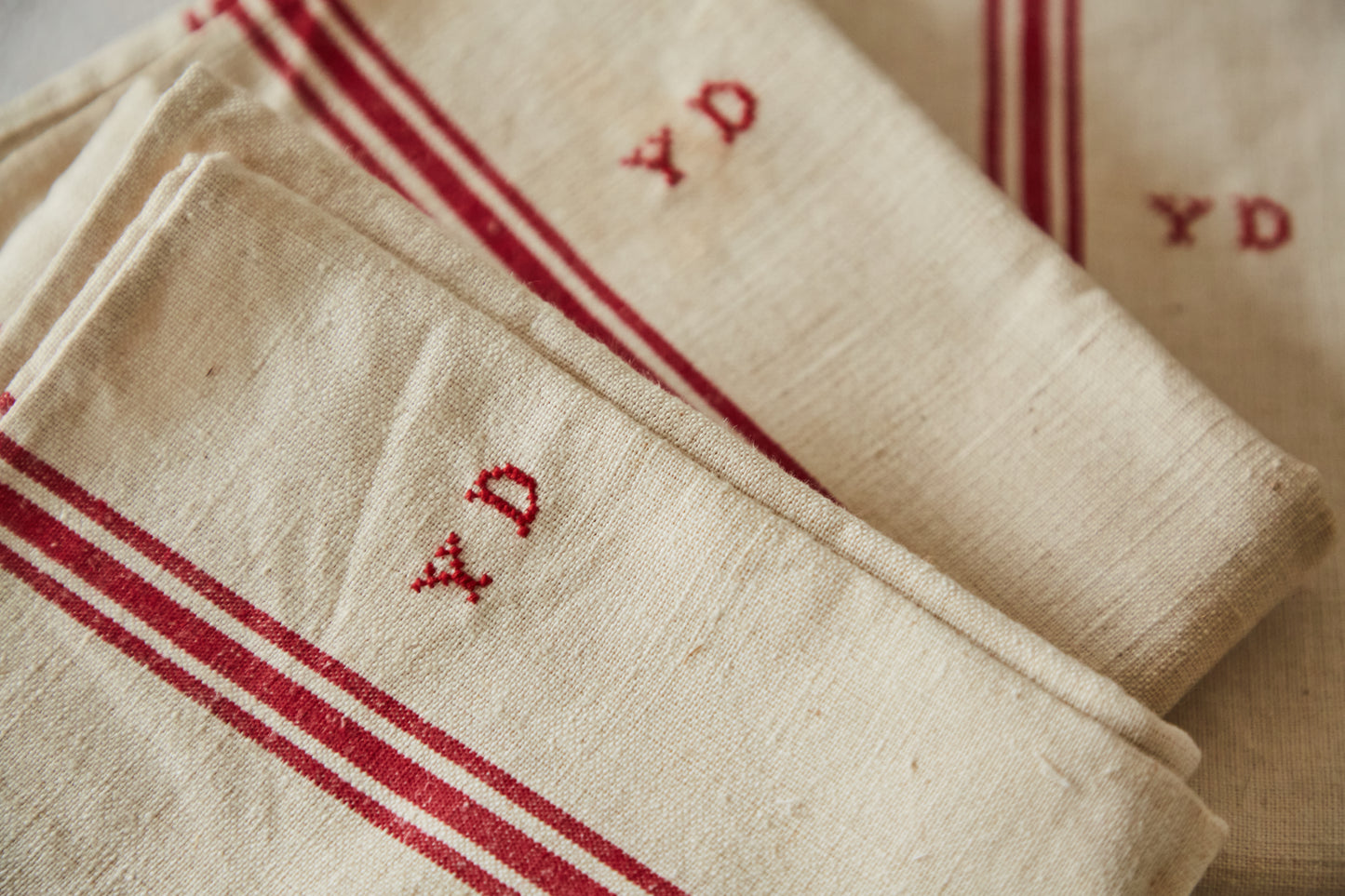 Three tea towels Y D embroidery
