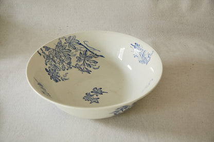 Large white ceramic wash bowl with blue flower print